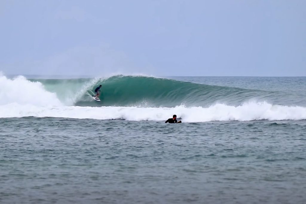 Surfer in the barrel at Sindhu Left